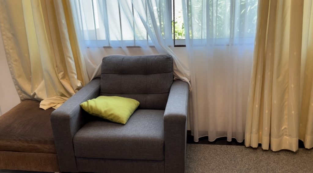 Comfortable Sofa In The Living Room With Curtains Behind Free Stock Video Footage