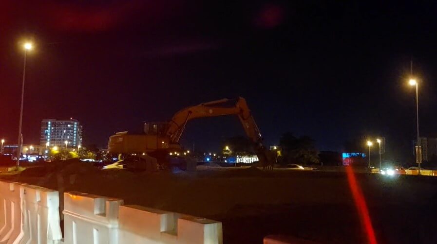 Night Excavator at the road side free stock video